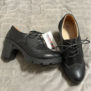 NWT black wingtip lace up heels